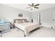 Spacious main bedroom features a ceiling fan, a large window, and neutral decor creating a serene environment at 18 Dot Dr, Wendell, NC 27591