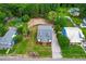 Aerial view of the house featuring a well-manicured lawn and mature trees at 18 W Academy St, Wendell, NC 27591