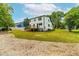 Landscaped backyard with newly built deck and large grassy area at 18 W Academy St, Wendell, NC 27591