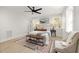 Cozy bedroom with a decorative rug, bench and chair, flooded with natural light at 18 W Academy St, Wendell, NC 27591
