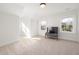 Well-lit bedroom with carpet, and lots of natural light creates a serene retreat at 18 W Academy St, Wendell, NC 27591