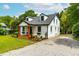Charming home with stone driveway, front porch, and lovely landscaping at 18 W Academy St, Wendell, NC 27591
