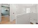 Bright hallway with white walls, natural light, and hardwood floors leading to rooms at 18 W Academy St, Wendell, NC 27591