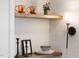 Charming shelving with decor and a stylish sconce brighten the space at 18 W Academy St, Wendell, NC 27591