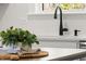 Modern kitchen with updated fixtures, stainless steel hardware, and a subway tile backsplash at 18 W Academy St, Wendell, NC 27591