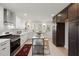 Modern kitchen with white cabinets, stainless steel appliances, and a central island at 18 W Academy St, Wendell, NC 27591