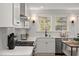 Spacious kitchen featuring stainless steel appliances, and white cabinets at 18 W Academy St, Wendell, NC 27591