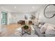 Comfortable living room with a cozy atmosphere and a harmonious blend of neutral tones and textures at 18 W Academy St, Wendell, NC 27591