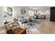 Bright living room features a modern aesthetic with lots of natural light and opens to the kitchen at 18 W Academy St, Wendell, NC 27591
