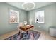 Bright office with a modern desk, chair, decor, and large windows at 18 W Academy St, Wendell, NC 27591