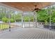 Inviting screened in porch with a ceiling fan and backyard pool view at 1817 Foxbrook Dr, Raleigh, NC 27603