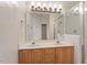 Bright bathroom features double sinks, wood cabinets and a glass door shower at 1817 Foxbrook Dr, Raleigh, NC 27603