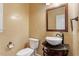 Cozy bathroom featuring a vessel sink with decorative cabinet and mirror at 1817 Foxbrook Dr, Raleigh, NC 27603