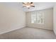 Minimalist bedroom has carpet, a ceiling fan and natural light from large windows at 1817 Foxbrook Dr, Raleigh, NC 27603