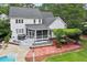 Aerial view of the home's backyard with a deck, patio, hot tub, and swimming pool at 1817 Foxbrook Dr, Raleigh, NC 27603