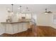 Open kitchen with granite countertops, stainless appliances, and pendant lighting at 1817 Foxbrook Dr, Raleigh, NC 27603