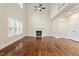 Spacious living room with hardwood floors, a fireplace, and a soaring ceiling at 1817 Foxbrook Dr, Raleigh, NC 27603