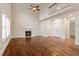 Open living room featuring hardwood floors, fireplace, and high ceilings at 1817 Foxbrook Dr, Raleigh, NC 27603