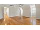 Spacious living room with hardwood floors and bright natural light at 1817 Foxbrook Dr, Raleigh, NC 27603