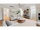 Comfortable living room featuring a sofa, plants, and shelves at 1817 Foxbrook Dr, Raleigh, NC 27603