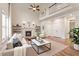 Bright living room with fireplace, high ceilings, hardwood floors, and ample natural light at 1817 Foxbrook Dr, Raleigh, NC 27603