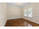 Bright room with natural light and hardwood flooring, perfect for a home office at 1817 Foxbrook Dr, Raleigh, NC 27603