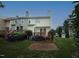 Backyard view of the townhome with a deck and patio at 1910 Trexler Ct, Raleigh, NC 27606