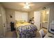 Bedroom with a ceiling fan, bed, and an attached bathroom at 1910 Trexler Ct, Raleigh, NC 27606