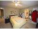 Comfortable bedroom featuring a ceiling fan, and an attached bathroom entrance at 1910 Trexler Ct, Raleigh, NC 27606