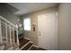 Inviting foyer with stairs, white trim, and a convenient entry to the home at 1910 Trexler Ct, Raleigh, NC 27606