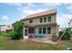 Backyard view with patio, screened in porch, grassy yard, and play area at 1939 Mostyn Ln, Apex, NC 27502