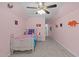 Charming bedroom with pink walls, a vaulted ceiling, and a colorful comforter at 1939 Mostyn Ln, Apex, NC 27502