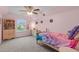 Bright bedroom with a vaulted ceiling and playful dinosaur décor at 1939 Mostyn Ln, Apex, NC 27502