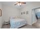 Comfortable bedroom with ceiling fan, carpet floors, and easy access to adjoining staircase at 1939 Mostyn Ln, Apex, NC 27502