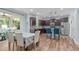The kitchen and dining area feature granite countertops, and stainless steel appliances at 1939 Mostyn Ln, Apex, NC 27502