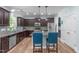 The kitchen boasts stainless steel appliances, granite countertops, and stylish pendant lighting at 1939 Mostyn Ln, Apex, NC 27502