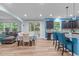 Open-concept kitchen and dining area with backyard access and stainless appliances at 1939 Mostyn Ln, Apex, NC 27502