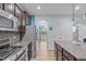 Well-equipped kitchen with stainless steel appliances, granite countertops, and ample cabinet space at 1939 Mostyn Ln, Apex, NC 27502