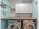 A beautifully organized laundry room with modern machines and ample storage space at 1939 Mostyn Ln, Apex, NC 27502
