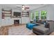 Comfortable living room featuring a cozy fireplace and built-in shelving at 1939 Mostyn Ln, Apex, NC 27502