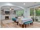 Bright and airy living room featuring a fireplace and access to the back yard at 1939 Mostyn Ln, Apex, NC 27502