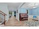 Open-concept living area with hardwood floors and an elegant archway at 1939 Mostyn Ln, Apex, NC 27502
