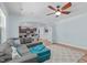 The comfortable living room is bathed in natural light, flowing into the kitchen at 1939 Mostyn Ln, Apex, NC 27502