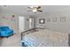 Relaxing main bedroom featuring a ceiling fan and a cozy accent chair at 1939 Mostyn Ln, Apex, NC 27502