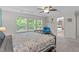 Bright main bedroom with a coffered ceiling and view into the ensuite bath at 1939 Mostyn Ln, Apex, NC 27502