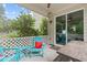 Relaxing covered patio area with outdoor seating and lush greenery at 1939 Mostyn Ln, Apex, NC 27502