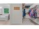 Spacious walk-in closet featuring multiple shelves and hanging storage at 1939 Mostyn Ln, Apex, NC 27502