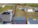 Aerial view of the property, highlighting the backyard with patio and outdoor seating, offering a private retreat at 1950 Menet St, Apex, NC 27502