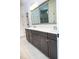 A bathroom features a large vanity with double sinks and a tiled floor at 1950 Menet St, Apex, NC 27502