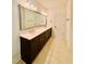 Bathroom featuring double vanity with modern fixtures and a large mirror at 1950 Menet St, Apex, NC 27502